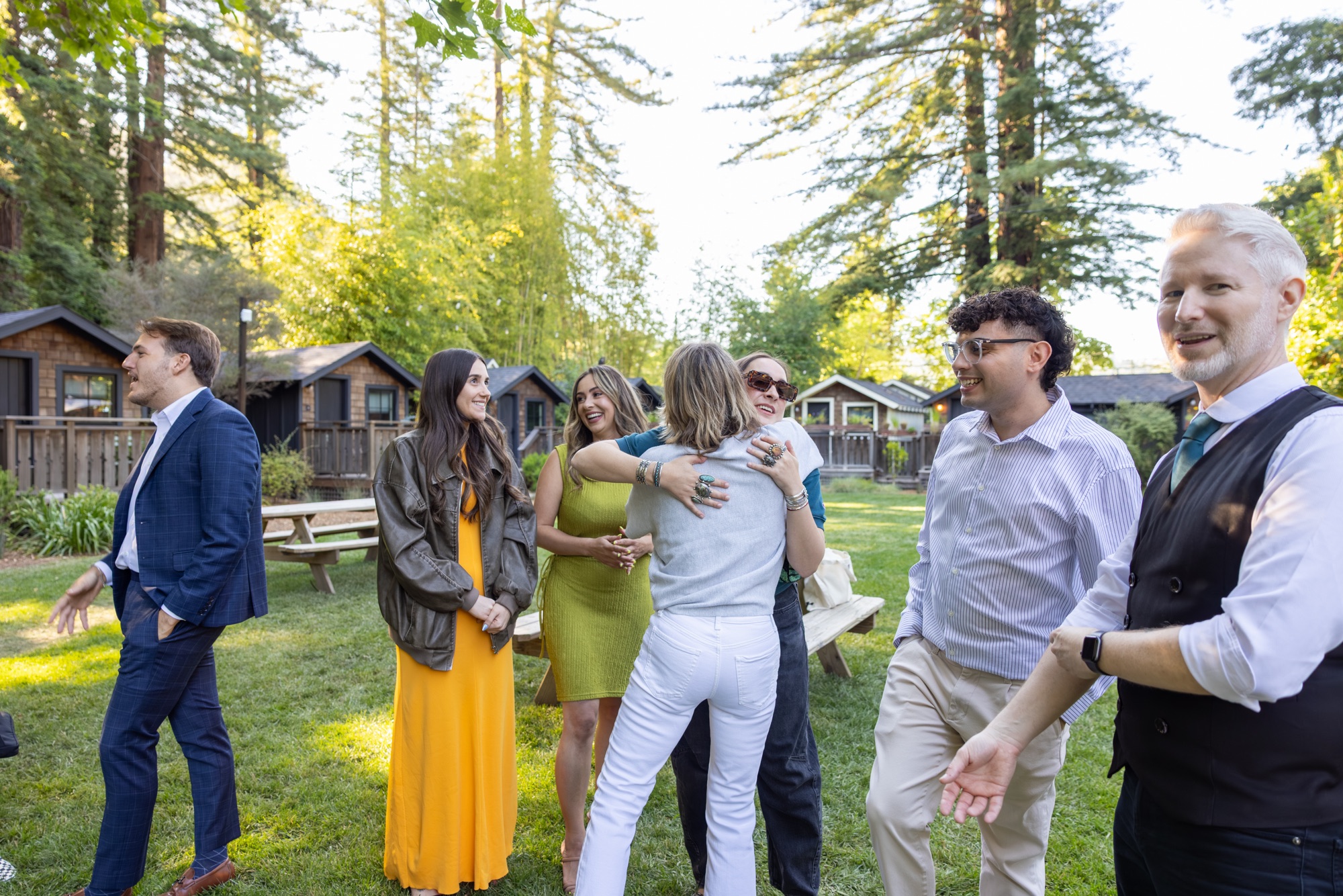 Team members greeting each other on the lawn at Dawn Ranch